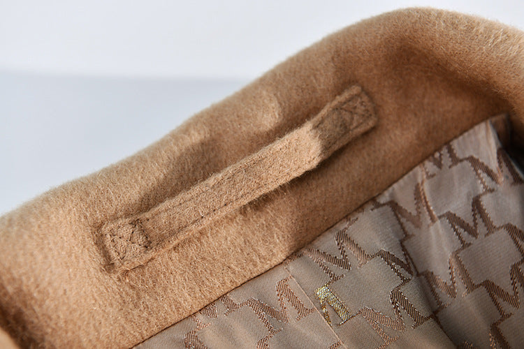 A close-up of the meticulous inner collar loop, designed for a garment that deserves care. From Borcelleclothes.