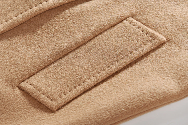The refined detail of the diagonally exposed single-welt pocket of the French Beige Coat. From Borcelleclothes.