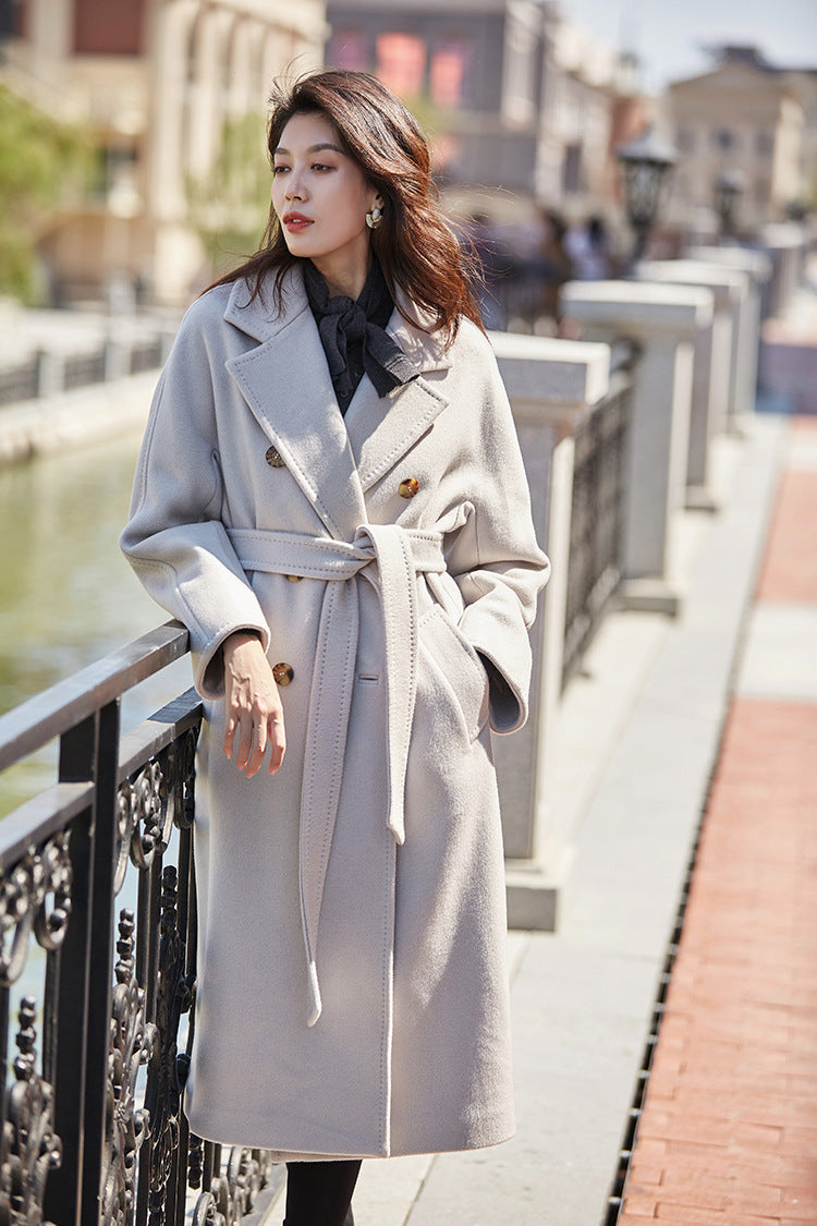 Looking out over the river channel, she finds tranquility in the cool composure of Romantic Light. From Borcelleclothes.