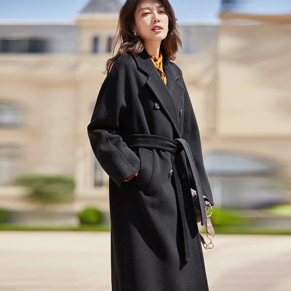 Women's mid-calf 100% lambswool coat in Signature Black, featuring a double-breasted design with tortoise-shell buttons and structured sleeve panels. — From Borcelleclothes.
