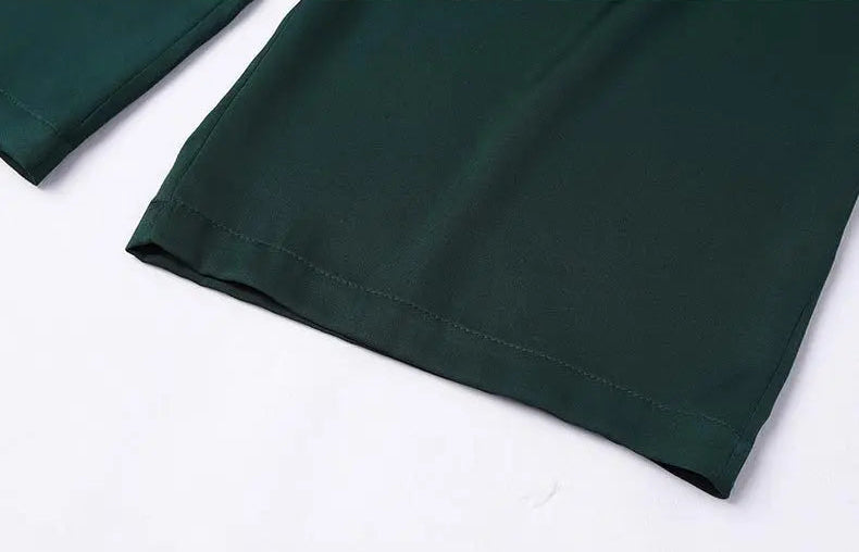 Close-up of the pristine bottom hem on mid-calf Cyber Jade Mulberry silk trousers — From Borcelleclothes.