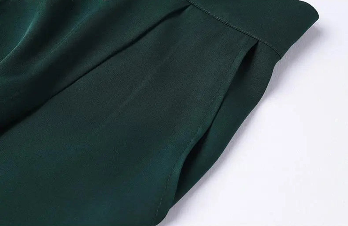 Macro view of the side slash pocket construction on Cyber Jade silk trousers — From Borcelleclothes.