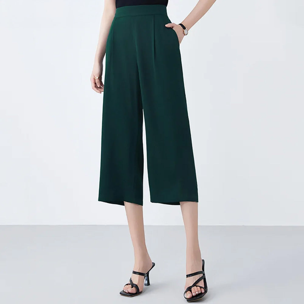 Women's wide-leg Mulberry silk trousers in Cyber Jade with front pleats, elasticated waistband & pockets. — From Borcelleclothes.