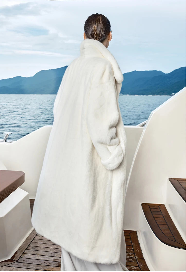 Back view of White Echo mink coat, showing seamless surface and uninterrupted vertical fur grain. — From Borcelleclothes.