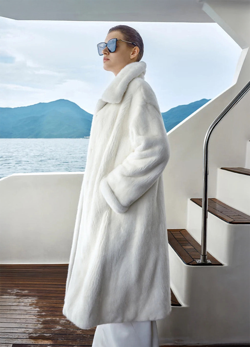 Women’s minimalist full-length mink fur coat with clean silhouette, hidden hook closure, and seamless surface — shown in White Echo. — From Borcelleclothes.