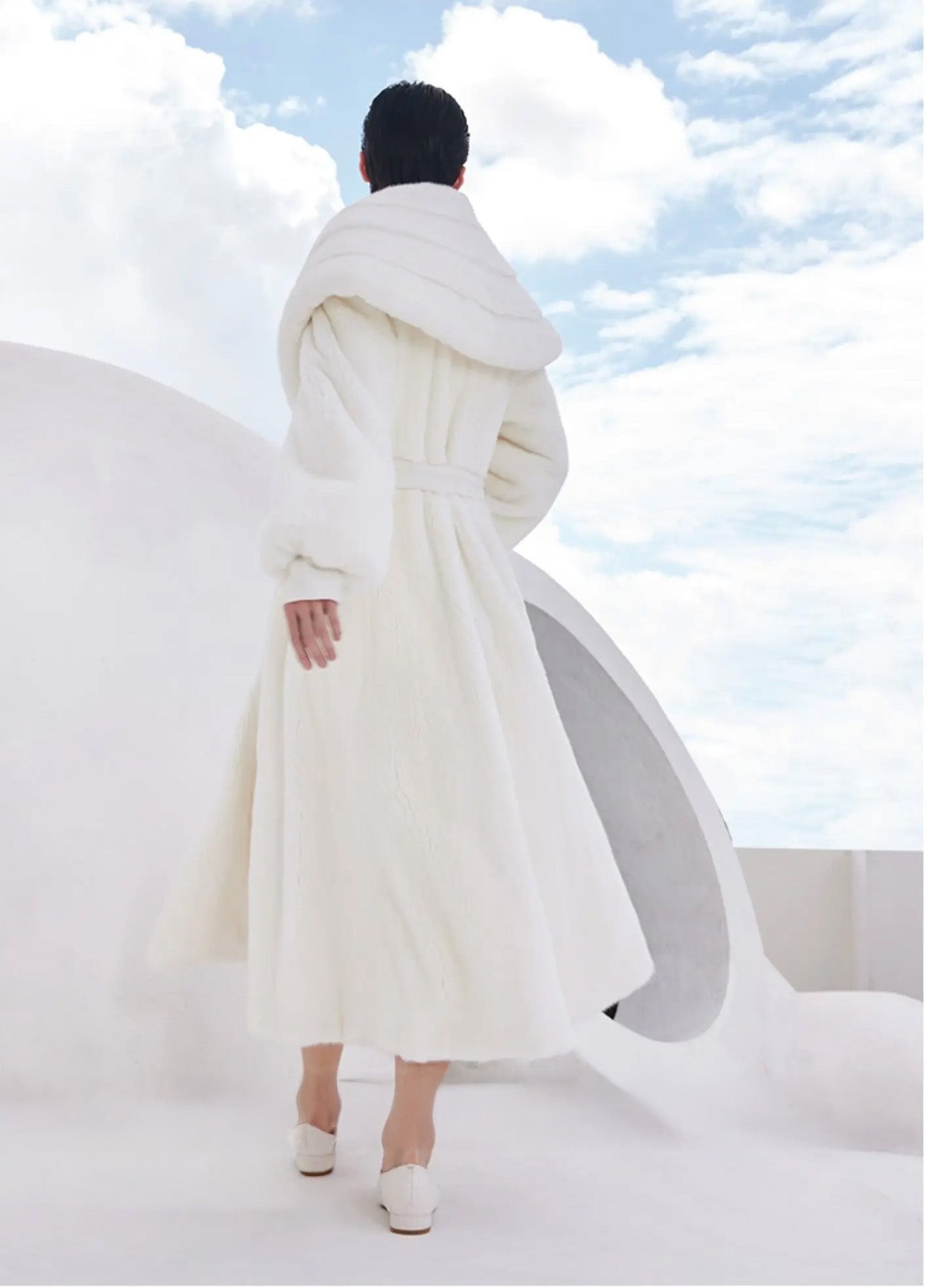 Full back view of the white mink coat Donne-Moi Ton Cœur, showing the belt and soft fur texture — From Borcelleclothes.