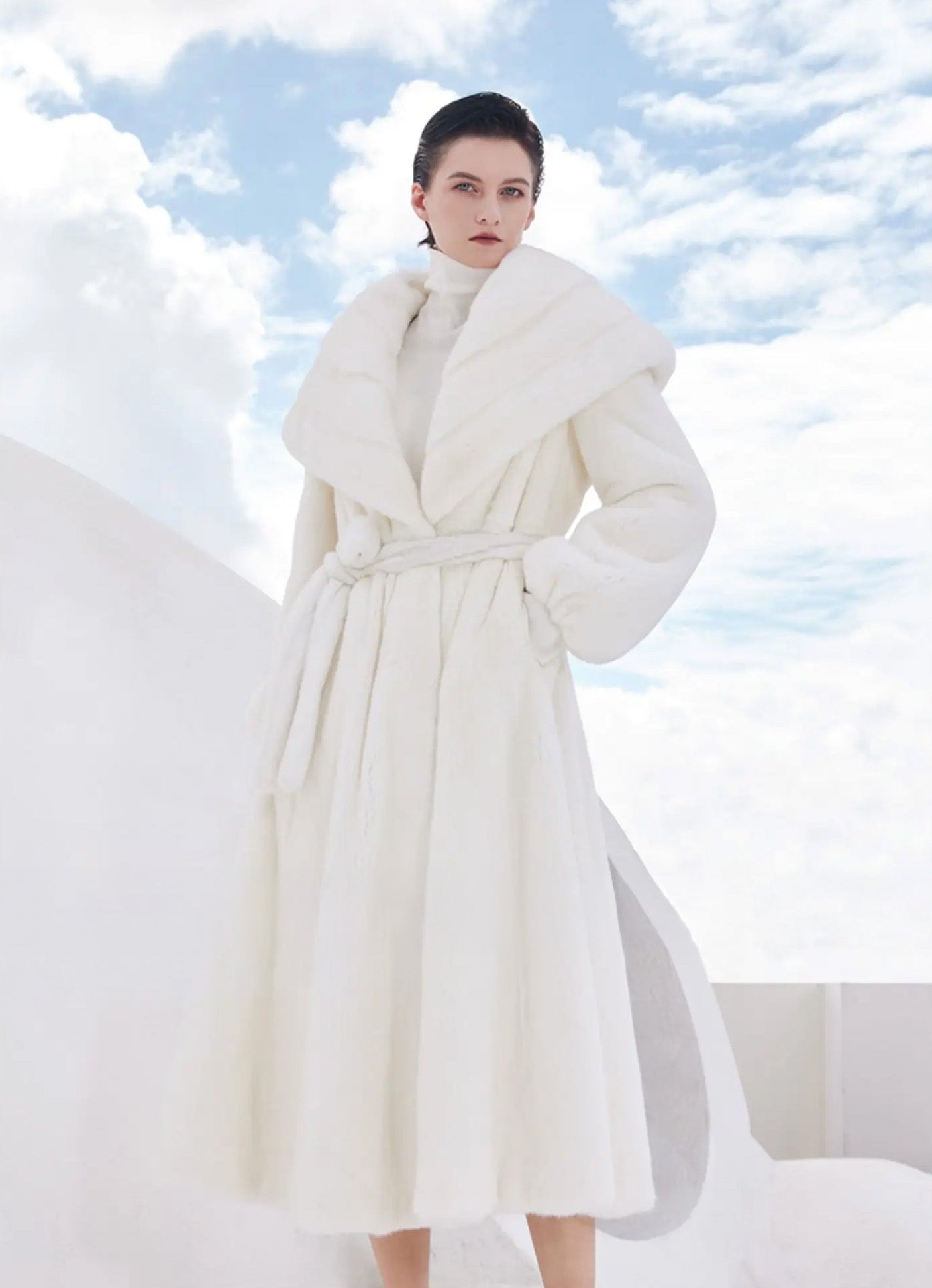 Model wearing the white mink coat Donne-Moi Ton Cœur with one hand placed inside the side-entry pocket — From Borcelleclothes.
