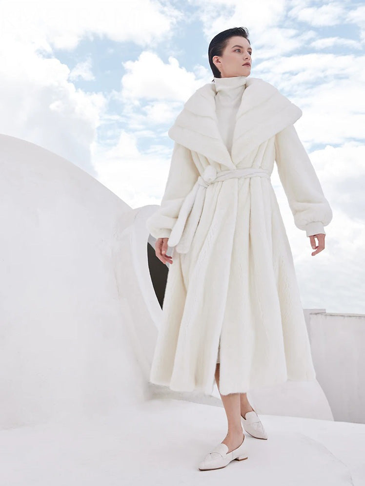 Model in the Donne-Moi Ton Cœur mink coat walking forward mid-step, capturing movement of the flared silhouette — From Borcelleclothes.