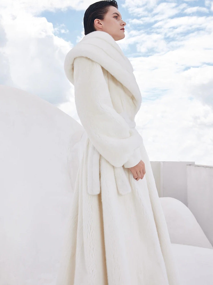 Side view of the Donne-Moi Ton Cœur white mink coat showing the wrap cut and shawl collar — From Borcelleclothes.