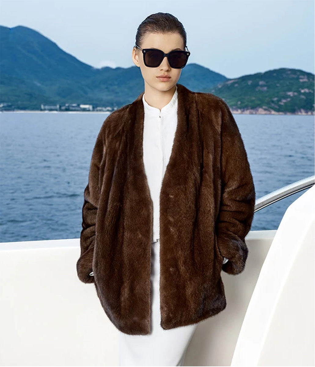 Women's sheared mink coat with V-neckline and turned-back cuffs, relaxed straight silhouette, shown in Trace of Clove color — From Borcelleclothes.