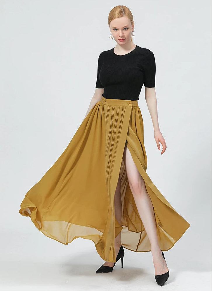 Front view of a model dynamic swirling in the mixed-texture silk wrap skirt, showcasing the contrast between heavy silk and flowing georgette — From Borcelleclothes.