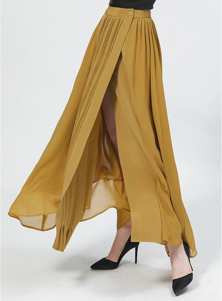 Side view of a model swirling in a luxury Aztec Gold mixed-texture silk wrap skirt, showing the motion of the georgette fabric — From Borcelleclothes.