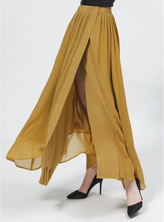 Side view of a model swirling in a luxury Aztec Gold mixed-texture silk wrap skirt, showing the motion of the georgette fabric — From Borcelleclothes.