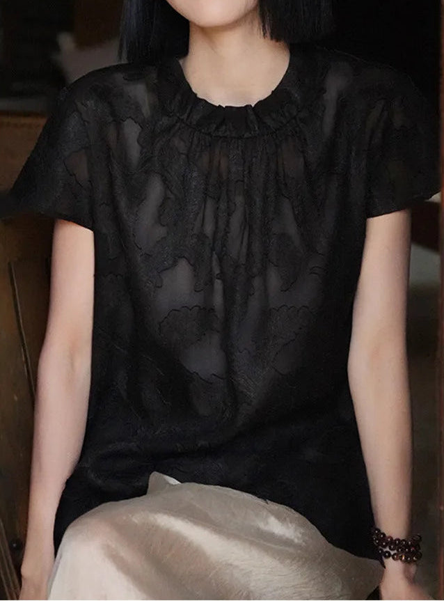 Women's Mulberry Silk Blouse in Bittersweet Noir — model seated on a chair, showcasing the airy drape and sophisticated dark chocolate undertone — From Borcelleclothes.