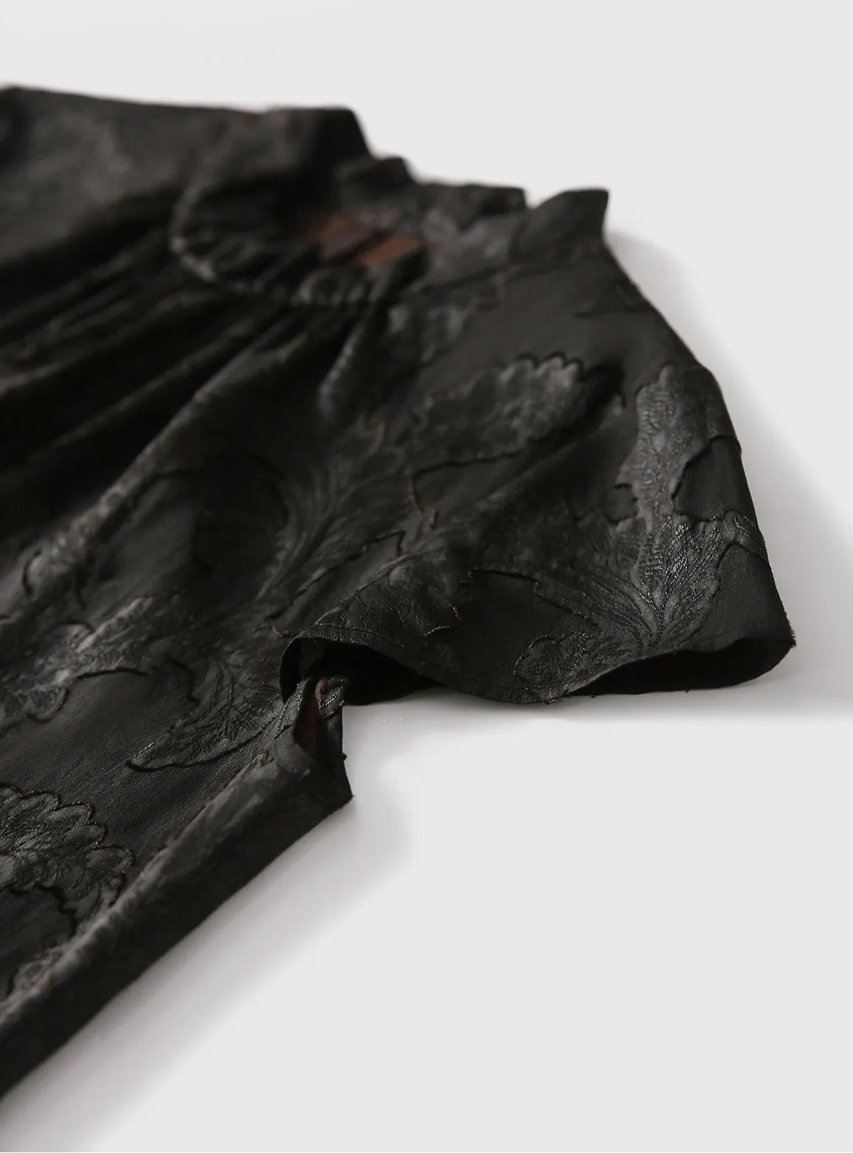 Detail shot of the extended cap sleeve and clean open armhole on the Mulberry Silk Blouse in Bittersweet Noir — From Borcelleclothes.