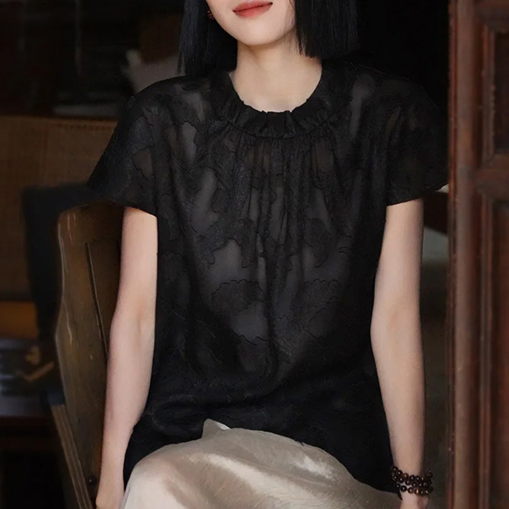 Women's Mulberry Xiangyunsha Silk blouse in Bittersweet Noir. Features embossed jacquard leaves on semi-sheer gauze, a wide banded, gathered neckline, and cap sleeves. — From Borcelleclothes.