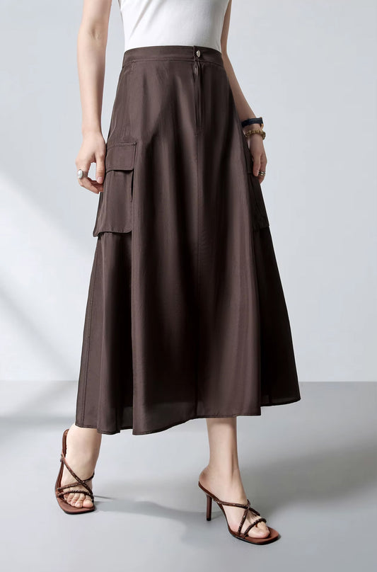 Flared Mulberry silk cargo midi skirt in Bitter Chocolate, side view of a model walking — From Borcelleclothes.