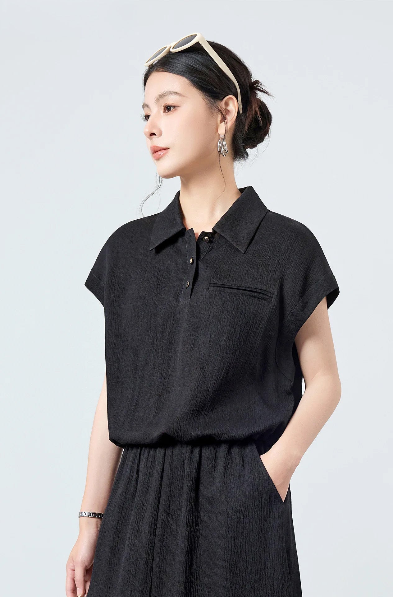 Women's Mulberry Silk Crinkled Polo Shirt in Melting Evening worn by model turned slightly to the side — From Borcelleclothes.