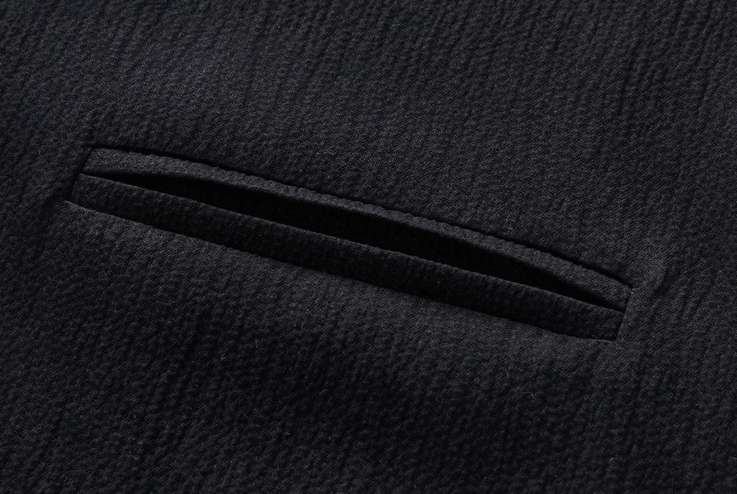 Tailored chest double-welt pocket detail on the Melting Evening Mulberry silk crinkled polo shirt — From Borcelleclothes.