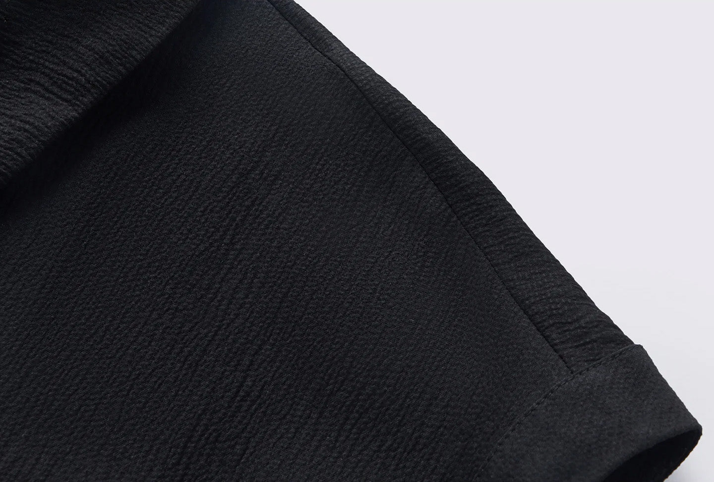 Extended dropped shoulder sleeve with wide decorative facing on the silk crinkled polo shirt — From Borcelleclothes.