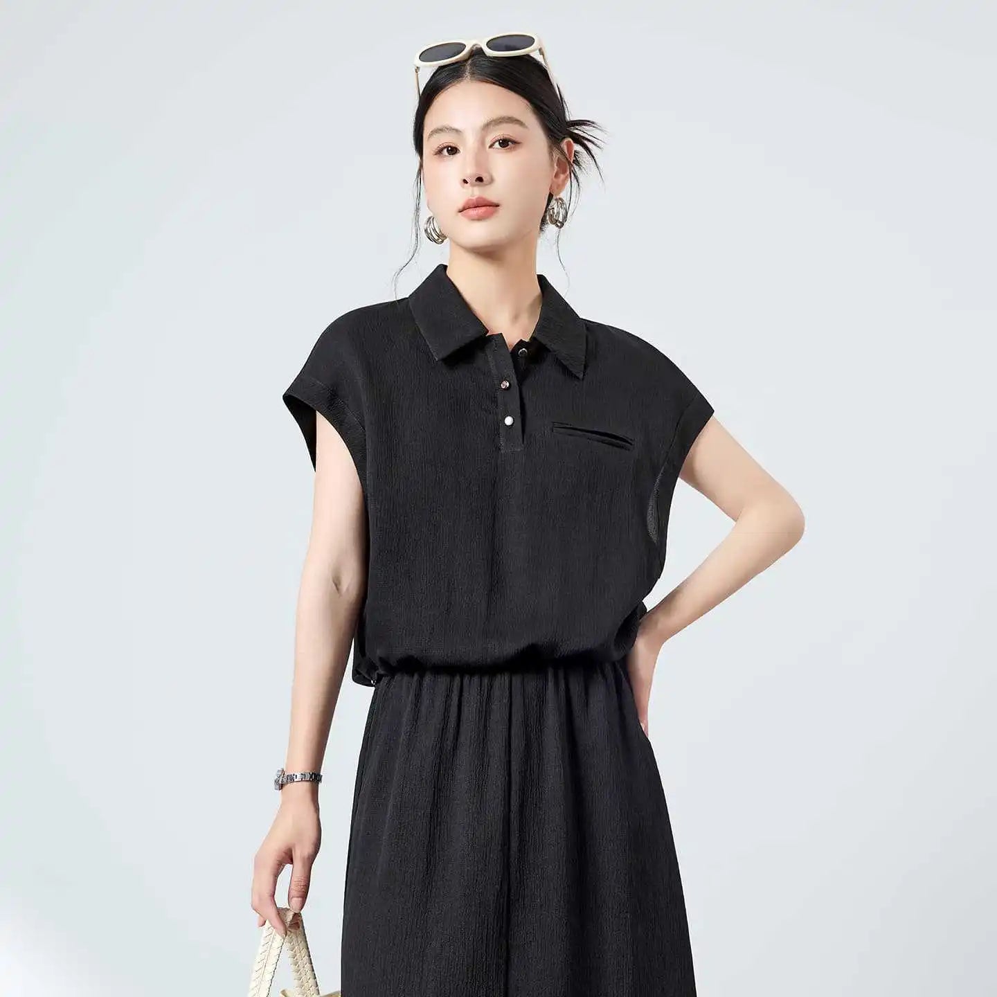 Women's 19 Momme Grade 6A Mulberry Silk Crepe polo in Melting Evening, with a crinkled texture. Features a pointed collar, double-welt chest pocket, and natural mother-of-pearl buttons. — From Borcellelothes.