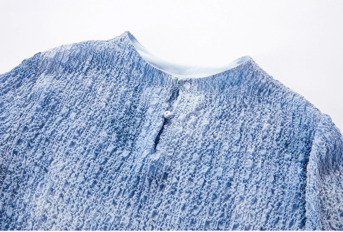 Upper back detail showing the vertical slit and smooth interior neck facing on the Cloudy Sky silk top — From Borcelleclothes.