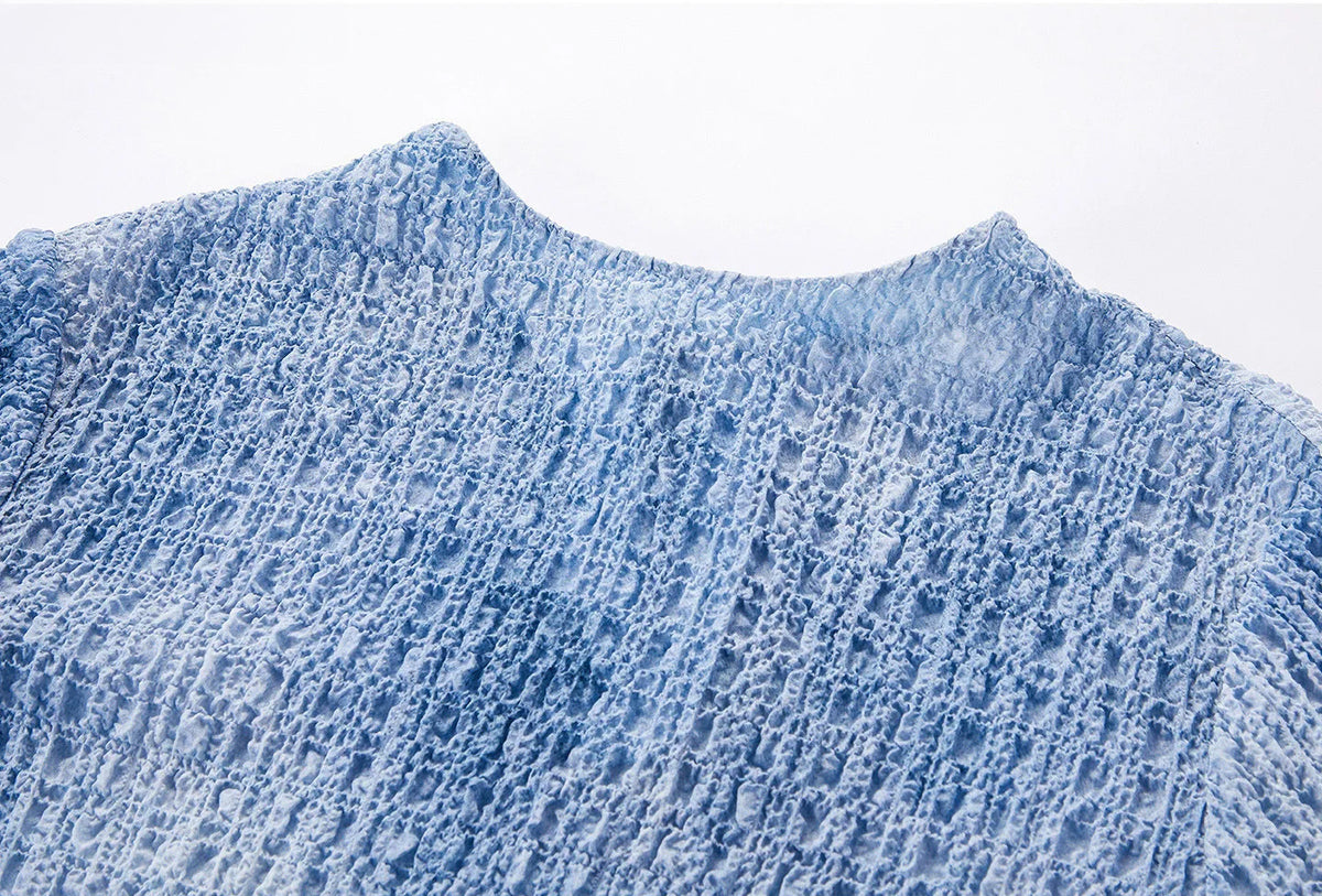 Front neckline and shoulder close-up of the Cloudy Sky mulberry silk puckered top — From Borcelleclothes.