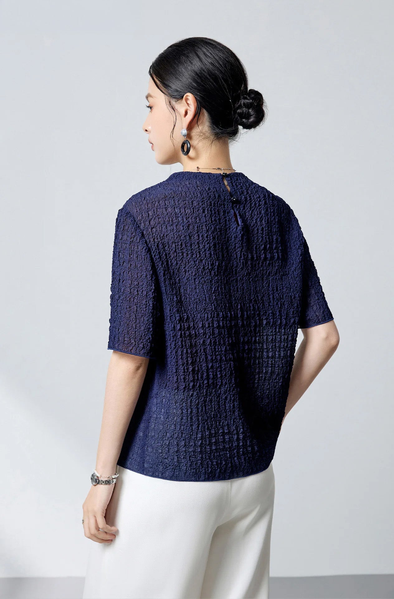 Back view of the Sagittarius mulberry silk puckered jacquard top showing the relaxed silhouette — From Borcelleclothes.