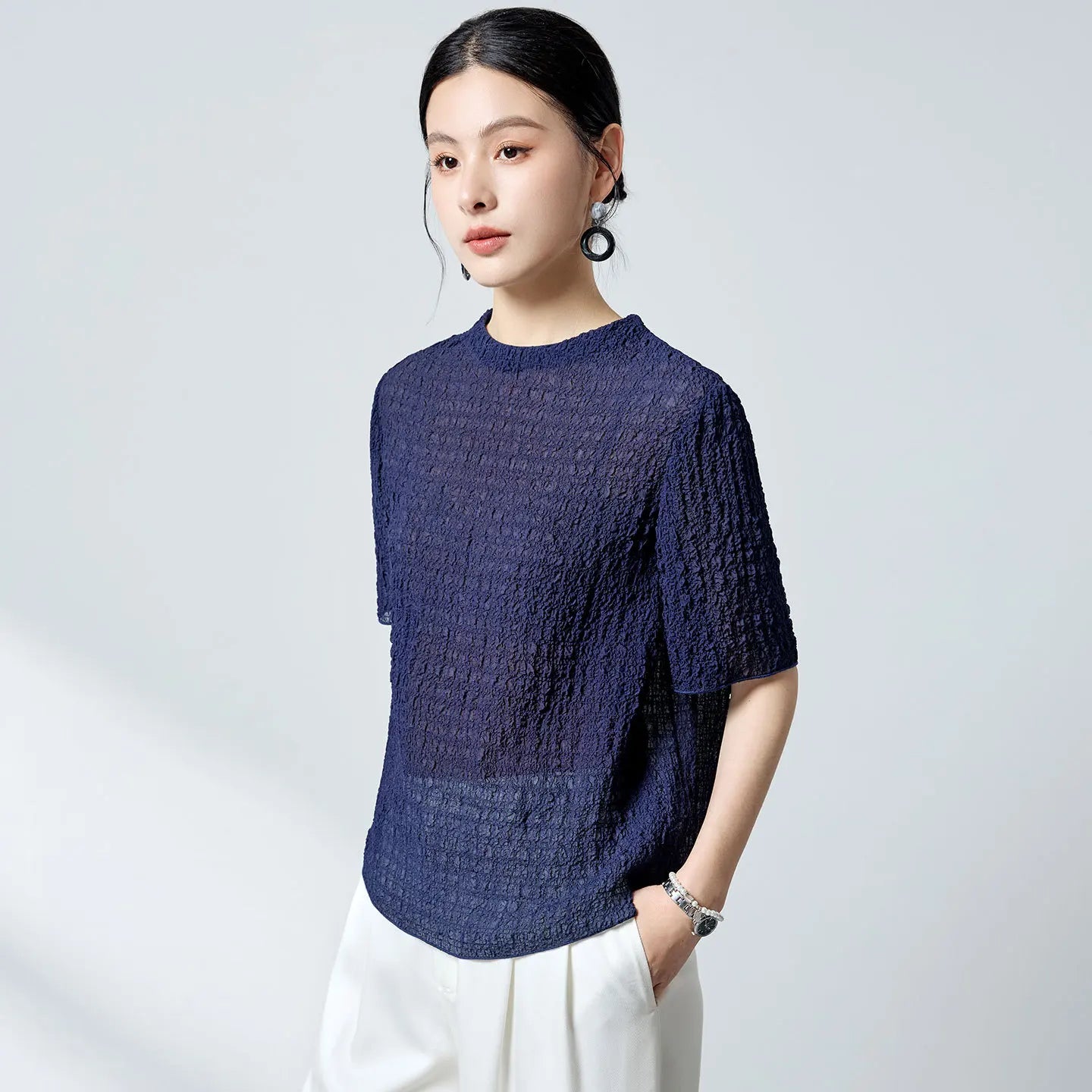 Women's Mulberry silk jacquard top in Sagittarius (18 momme). Features a 3D puckered texture, porcelain buttons, and a crease-free drape. — From Borcelleclothes.