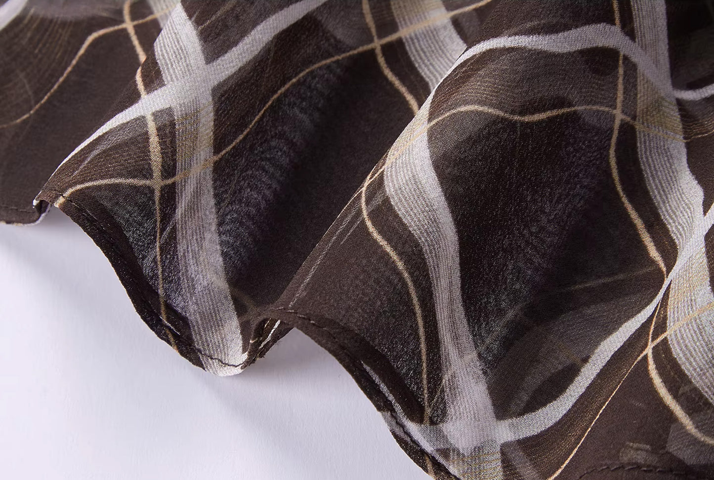 Close-up of the elegant bottom hem finishing on the Café Mirage Mulberry silk midi skirt — From Borcelleclothes.