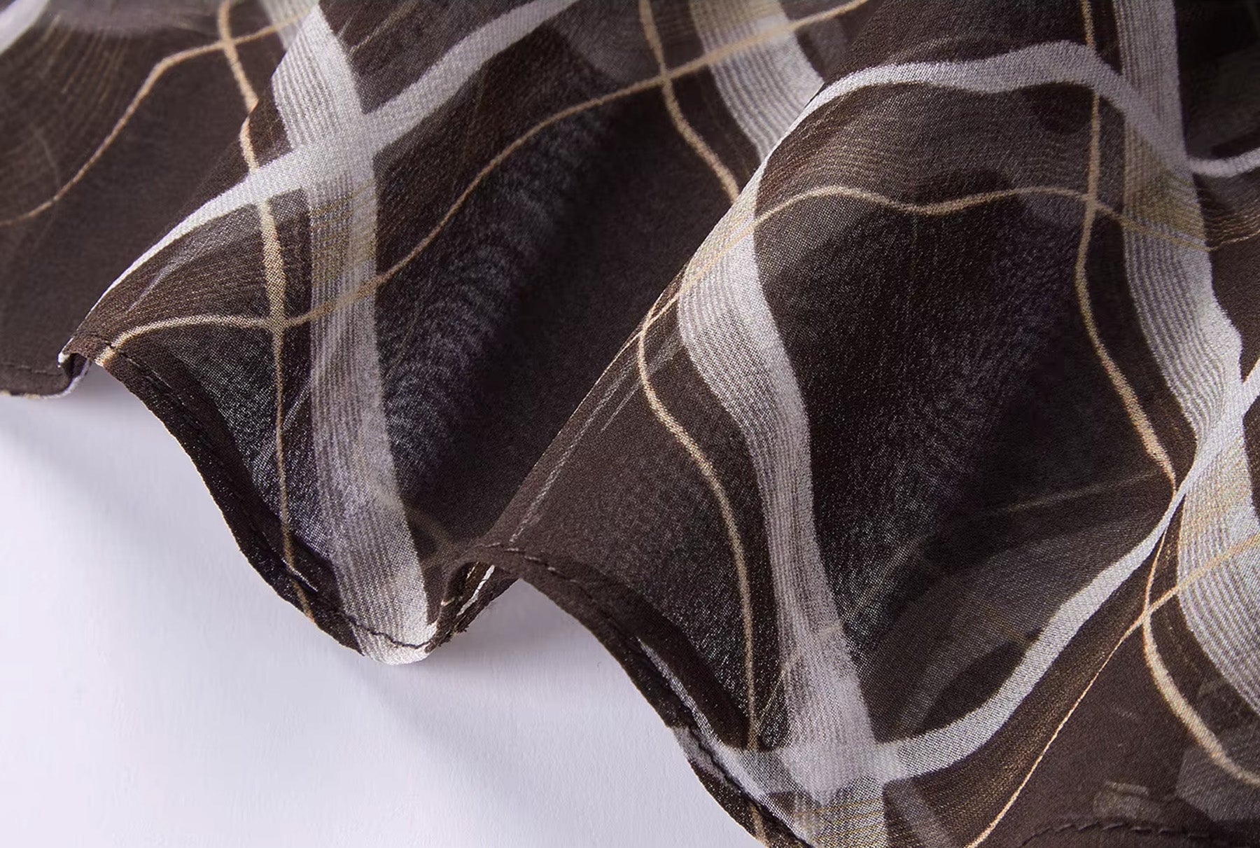 Close-up of the elegant bottom hem finishing on the Café Mirage Mulberry silk midi skirt — From Borcelleclothes.