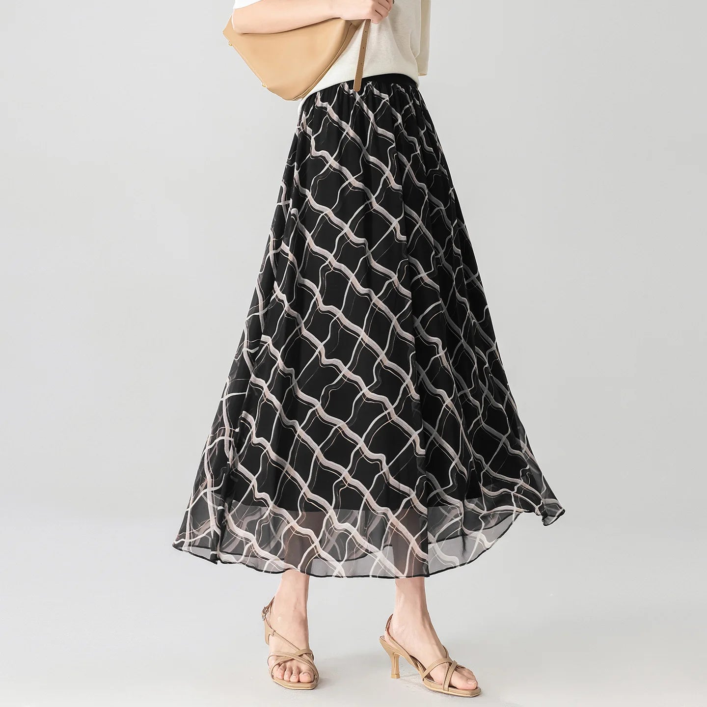 Women's  6A Grade Mulberry silk midi skirt in Night Hallucination, featuring an immersive 3D geometric print and a comfortable knit-rib waistband. — From Borcelleclothes.