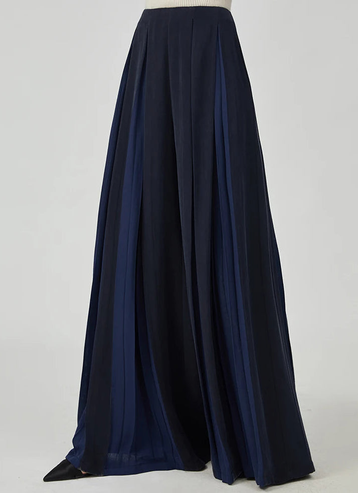 Women's Mulberry silk trousers with georgette inserts in Vortex Flower, featuring a model in a side view pose — From Borcelleclothes.