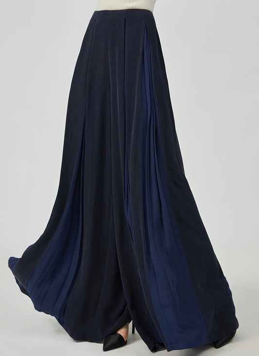 Women's Mulberry silk trousers with georgette inserts in Vortex Flower, featuring a model turned slightly to the side — From Borcelleclothes.