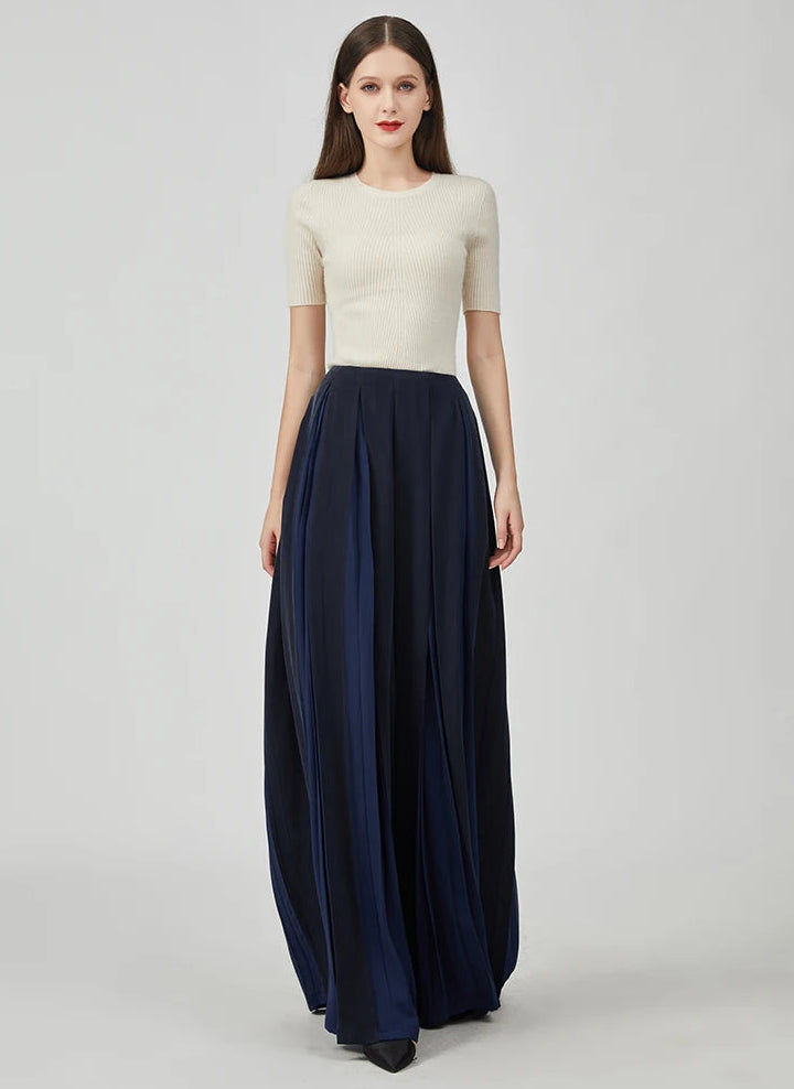 Women's Mulberry silk trousers with georgette inserts in Vortex Flower, featuring a model walking forward — From Borcelleclothes.