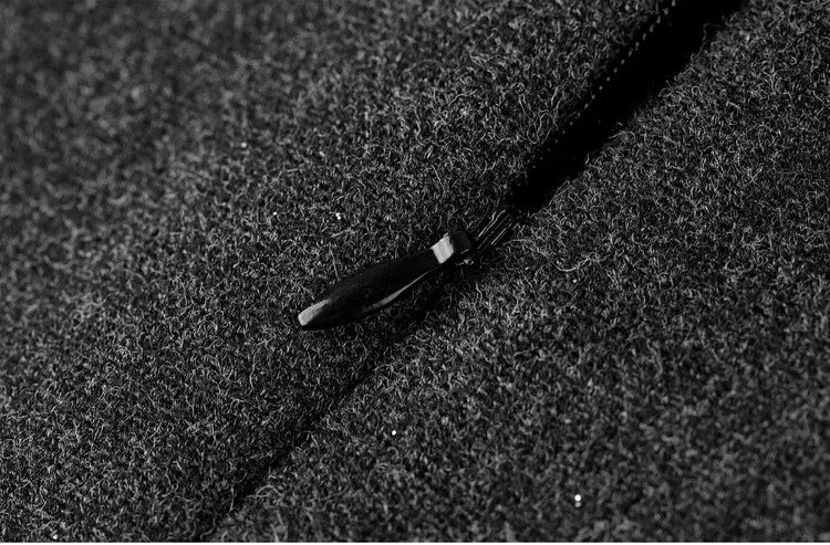 A precision close-up of the Improvisation midi skirt, showing the central back invisible zipper extending smoothly into the waistband for an architectural finish. — From Borcelleclothes.