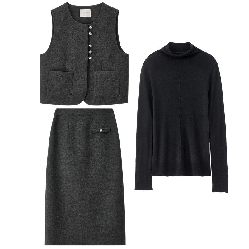 A flat lay presentation of the three-piece ensemble, showcasing the "blueprint" of the collection: the high-stretch black turtleneck, and the structured silver-lurex wool-blend vest and midi skirt. — From Borcelleclothes.
