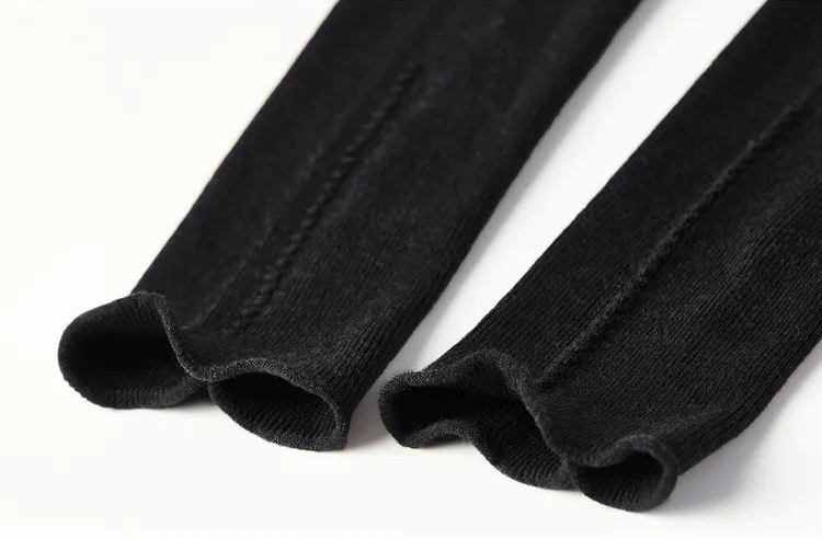 A detailed shot of the Syncopation turtleneck cuffs, where the structural exposed seams that run along the top of the sleeves meet the wrist, showcasing the impeccable reverse-seam craftsmanship. — From Borcelleclothes.