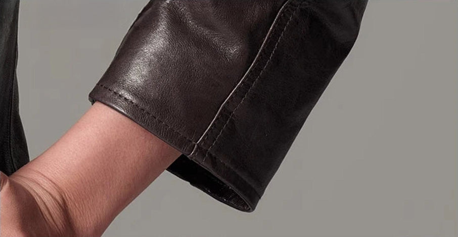 Macro detail of the sleeve cuff illustrating the responsive pull-up effect along edge seams — From Borcelleclothes.