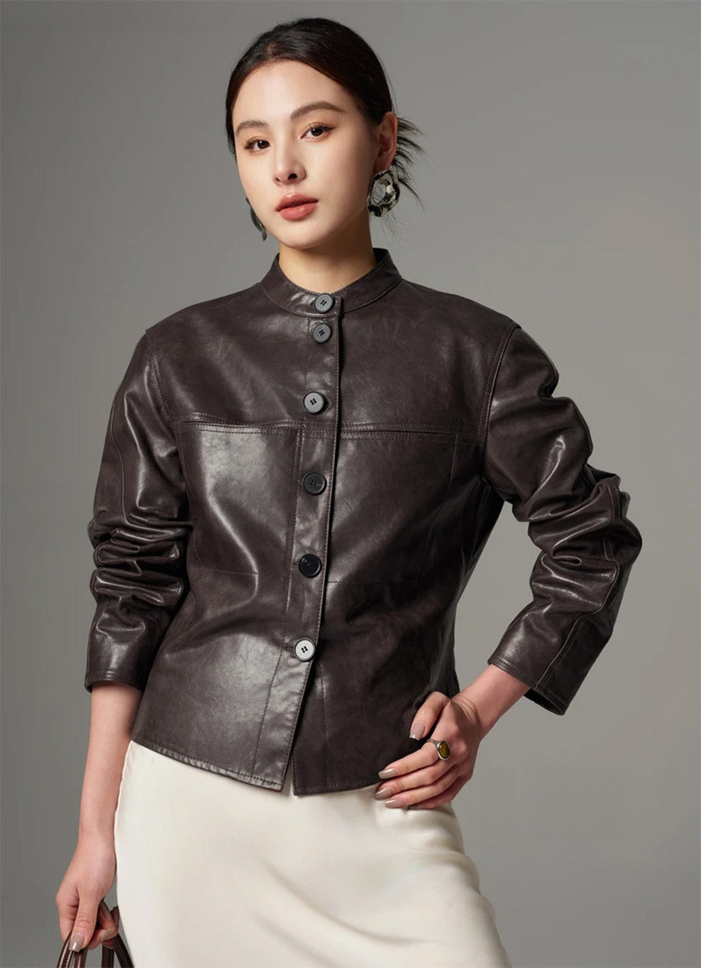 Three-quarter pose of model with one hand on hip, showing the cropped waistline and twin-needle stitched seams — From Borcelleclothes.