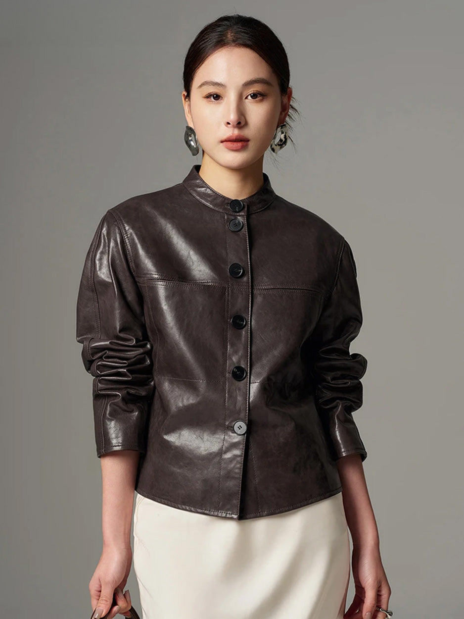 Model styling the cropped goatskin overshirt jacket with lifted sleeves, highlighting elbow gathers and supple drape — From Borcelleclothes.