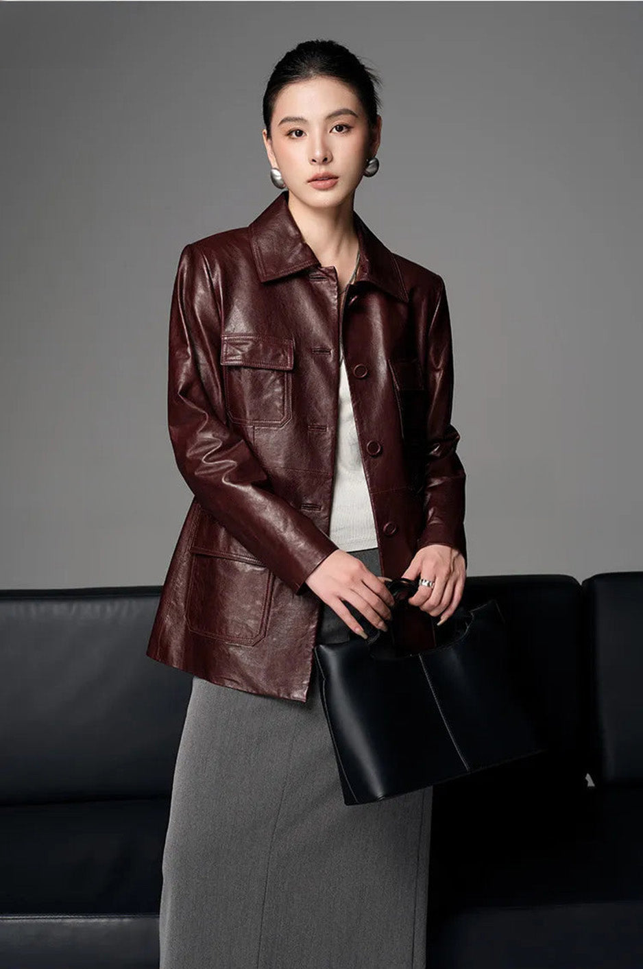 Model wearing Vintage Amarone waxed sheepskin safari jacket carrying an oversized bag — From Borcelleclothes.
