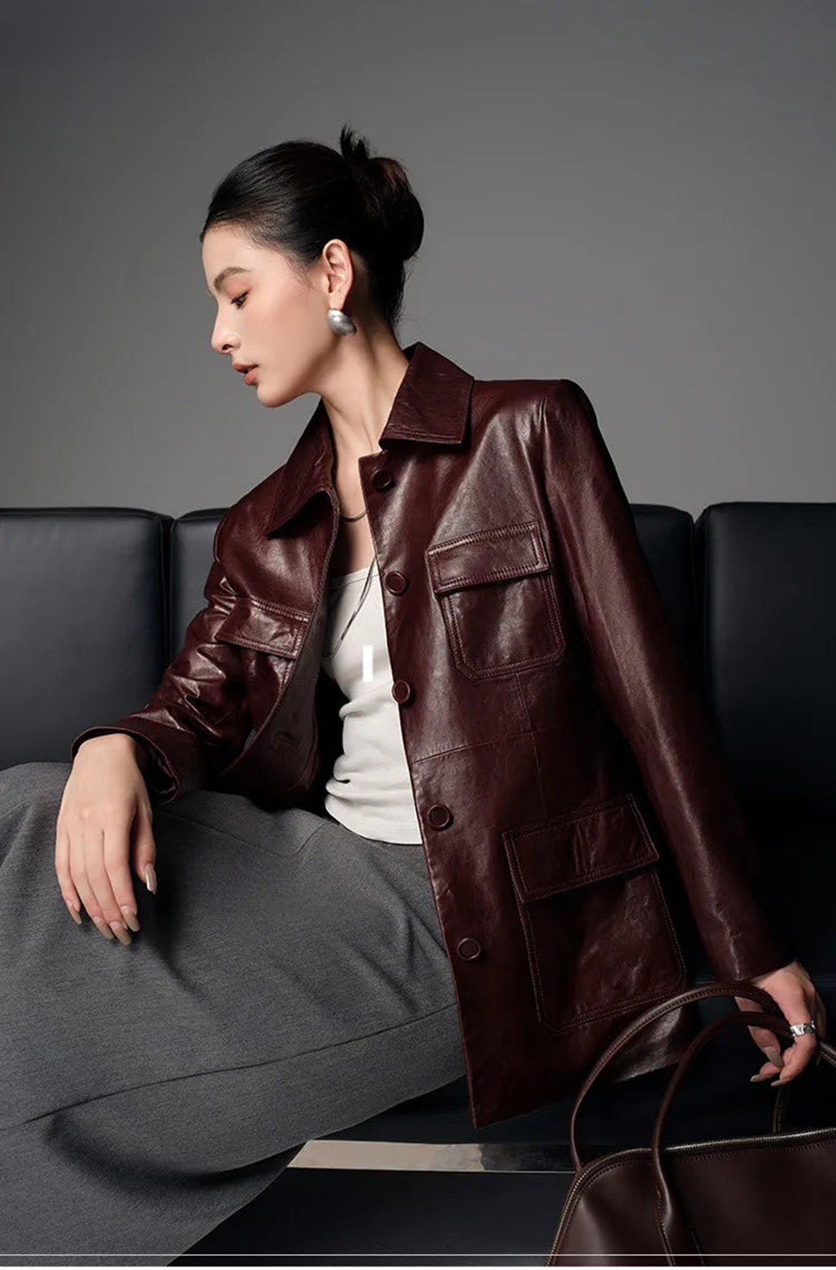 Model wearing Vintage Amarone waxed sheepskin safari jacket sitting on sofa — From Borcelleclothes.
