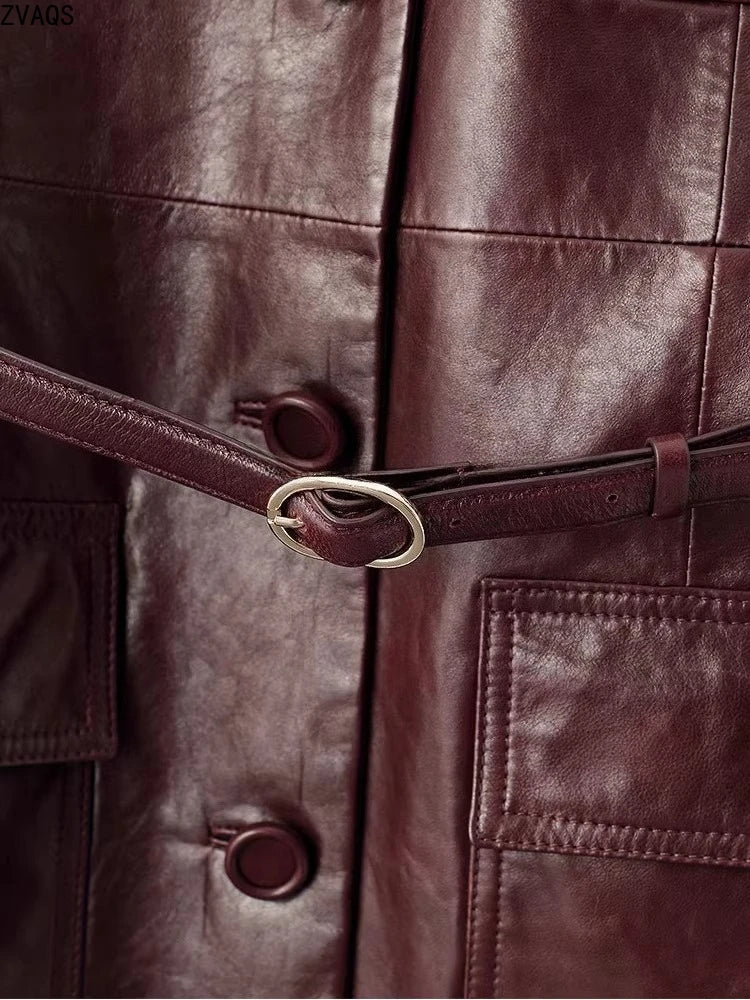 Detailed view of waist section, belt buckle, and leather-wrapped buttons in Vintage Amarone — From Borcelleclothes.