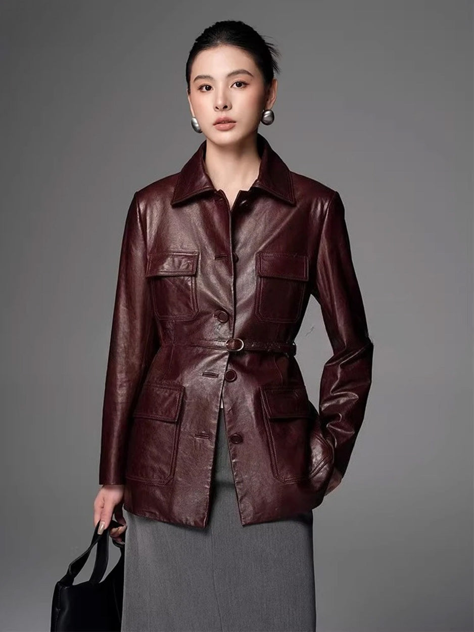 Women's Full-grain oil-waxed sheepskin jacket in deep Vintage Amarone. Features a belted safari silhouette, buttery drape, and a dynamic pull-up finish. — From Borcelleclothes.