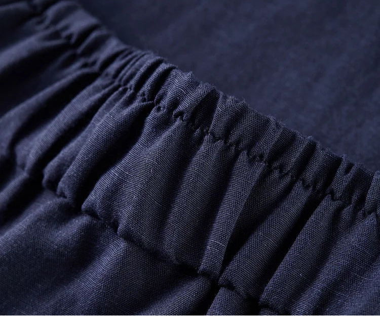 Detailed view of the structured waistband and pleats, ensuring a bespoke-level fit for the L'Oiseau Bleu trousers — From Borcelleclothes.