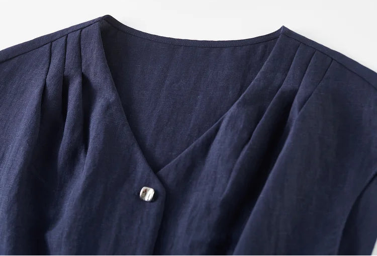 The clean, minimal lines of the L'Oiseau Bleu V-neckline, designed to elongate and frame the silhouette — From Borcelleclothes.