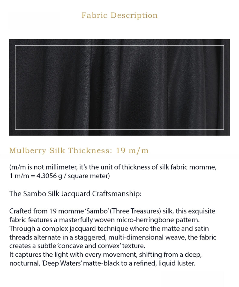 Artistic wave-folded texture of the Deep Waters black Mulberry silk, displaying the premium fabric's luxurious density and matte luster — From Borcelleclothes.