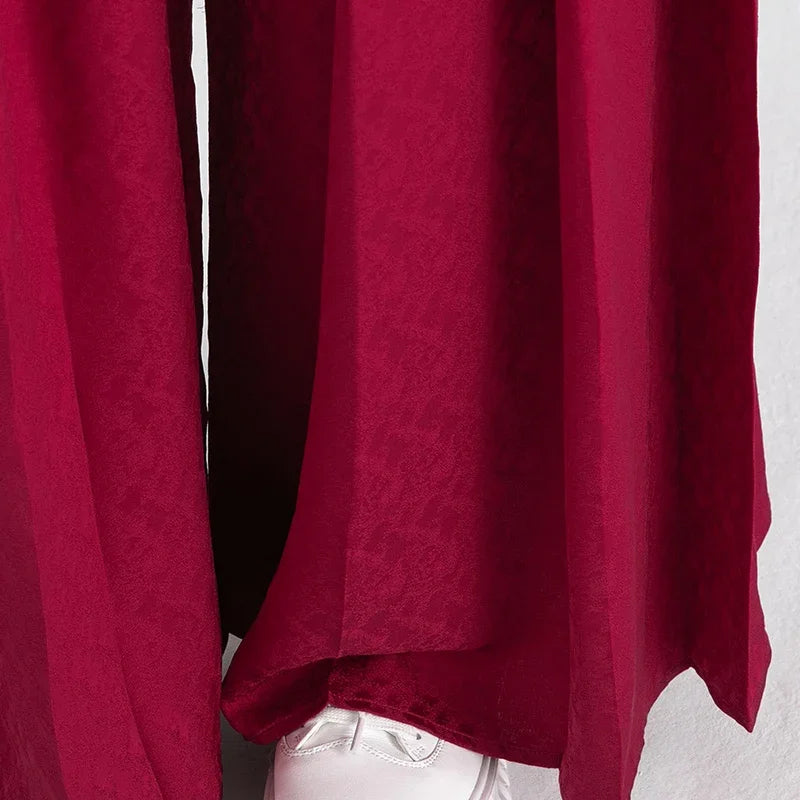 Close-up of the wide-leg bottom hem and fluid drape of 22 momme silk trousers — From Borcelleclothes.