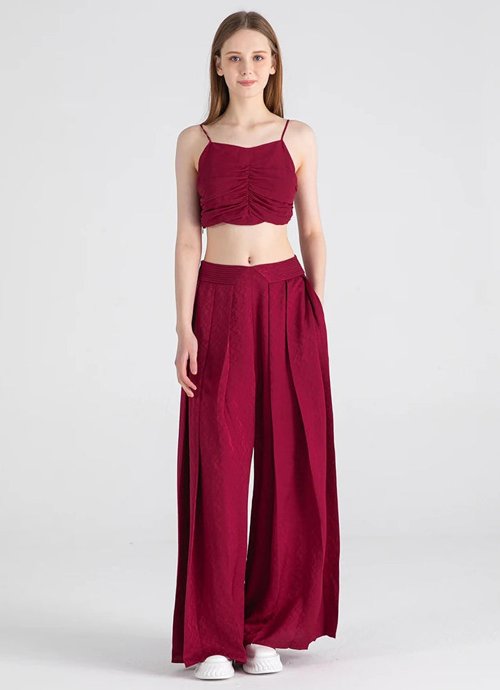 Full-height view of Queen of Night silk trousers featuring side seam pockets — From Borcelleclothes.